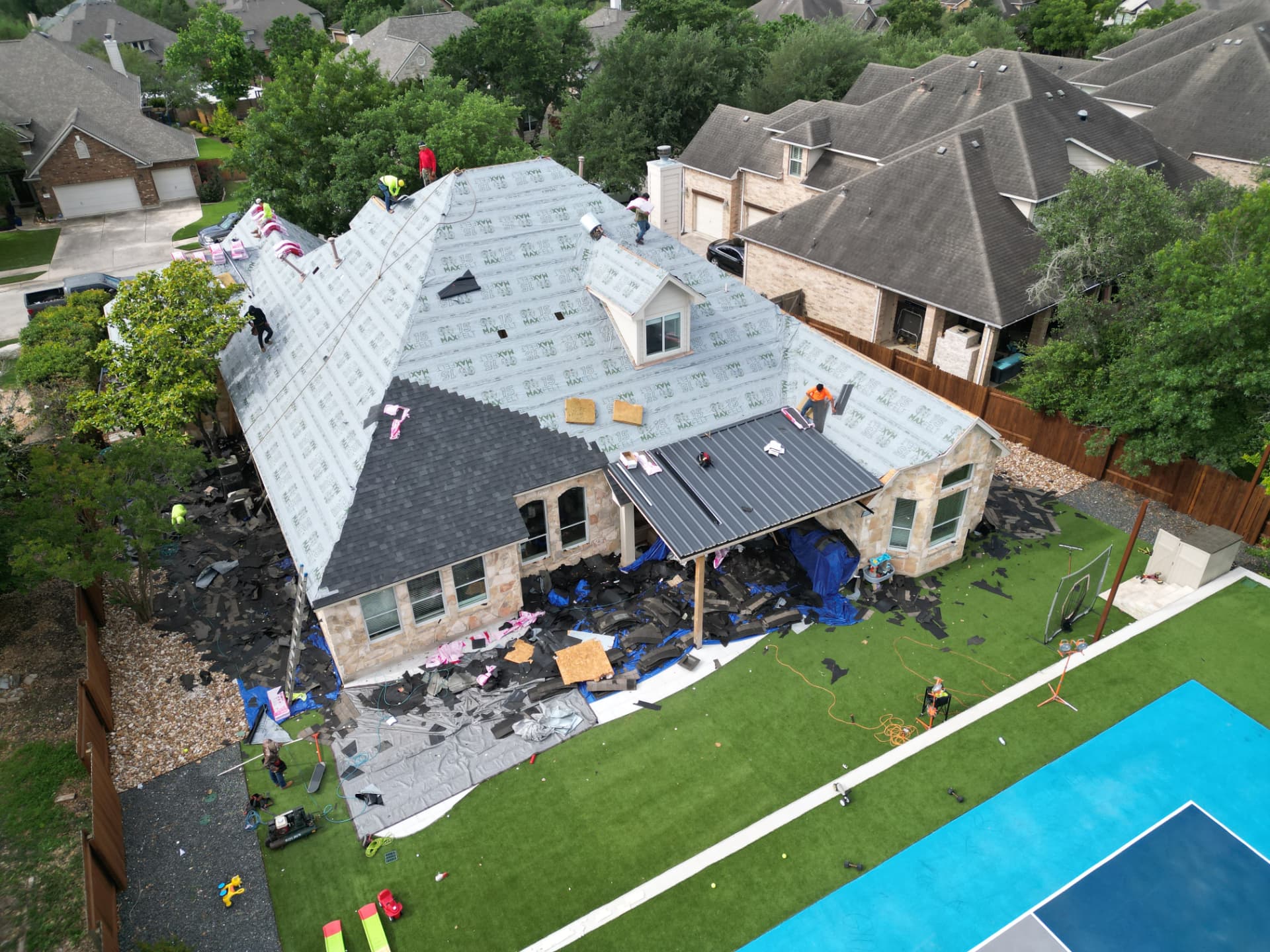 Aerial view of a roof replacement in progress on a Woodbridge home